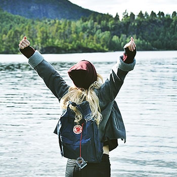 Person standing by lake